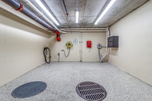 A car washing room in an apartment building garage