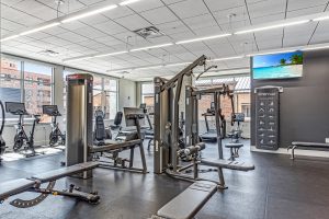 A gym with a lot of exercise equipment