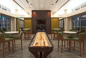 Club room with a large shuffle board in the middle
