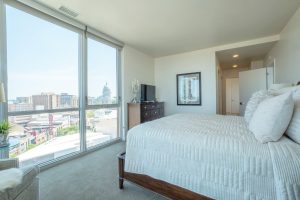 A luxury furnished apartment bedroom at Ovation