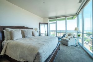 A luxury furnished apartment bedroom at Ovation